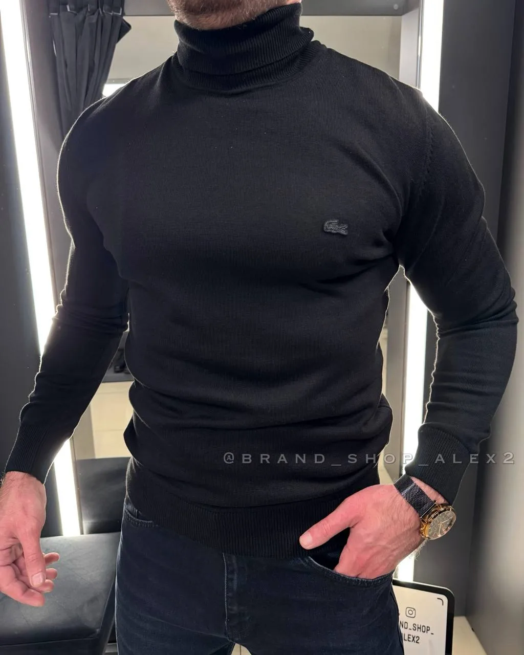 Чорний гольф Lacoste 